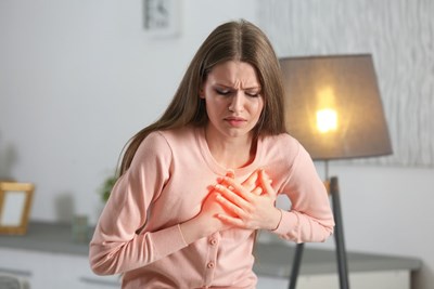 A person with chest pain to show someone suffering from acid reflux. 